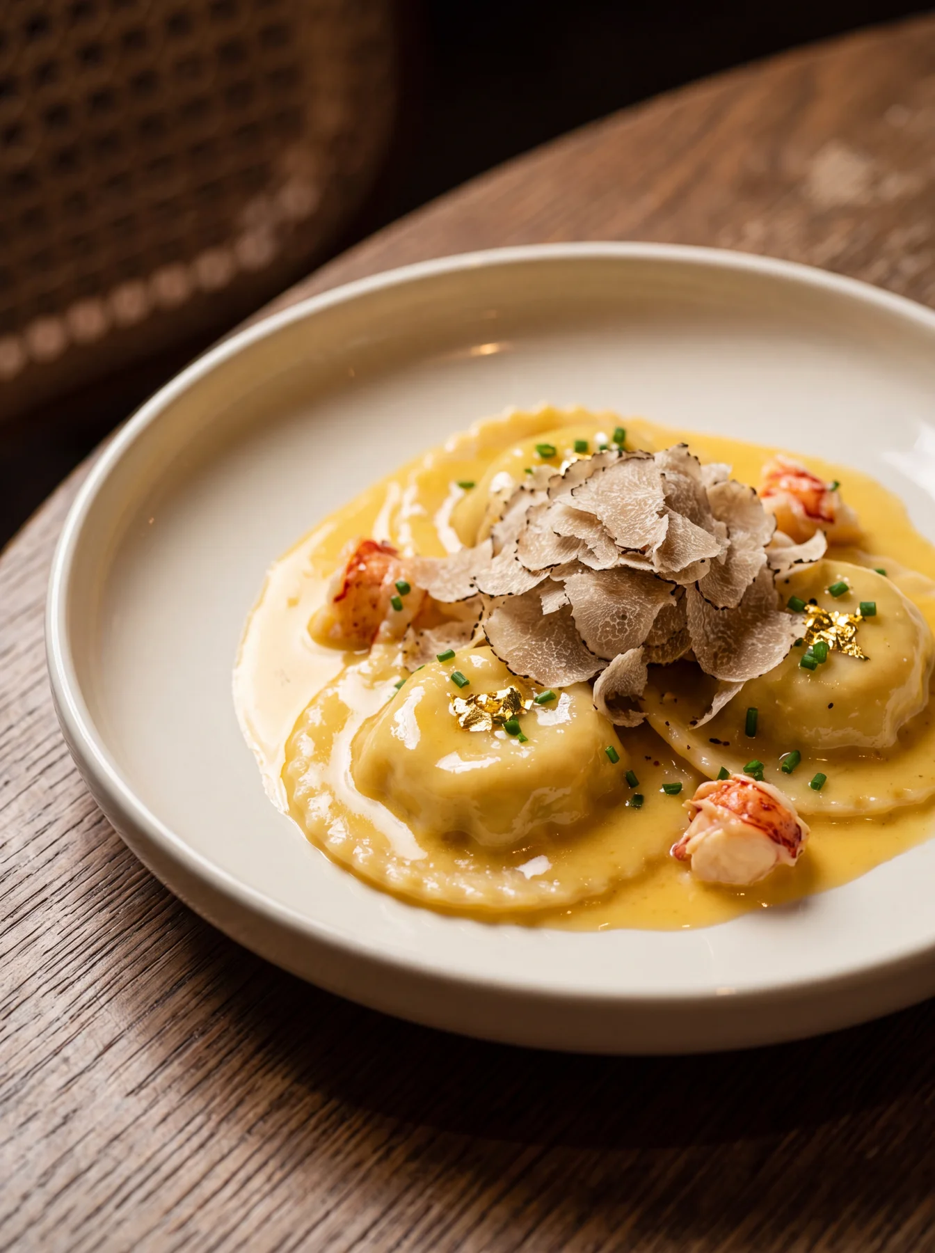 Lobster ravioli with truffles in golden sauce